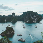 iPhone showing eSIM data connection with Ha Long Bay in background — best eSIM for Vietnam from Australia