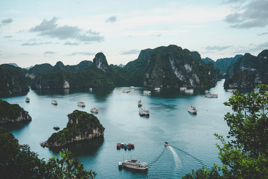 iPhone showing eSIM data connection with Ha Long Bay in background — best eSIM for Vietnam from Australia